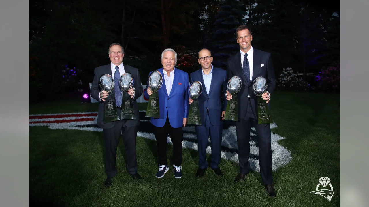 Patriots Quarterback Tom Brady, Head Coach Bill Belichick, Owner Robert Kraft, and President Jonathan Kraft hold the Patriots six Lombardi trophies at a ring ceremony celebrating their Super Bowl LIII victory.