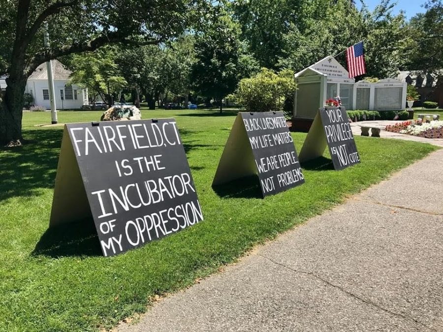 Signs from a peaceful anti-racism demonstration on the town green in June 