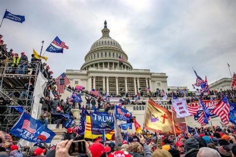 A view of the United States Capitol Building surrounded by rioters and insurrectionists on January 6, 2021