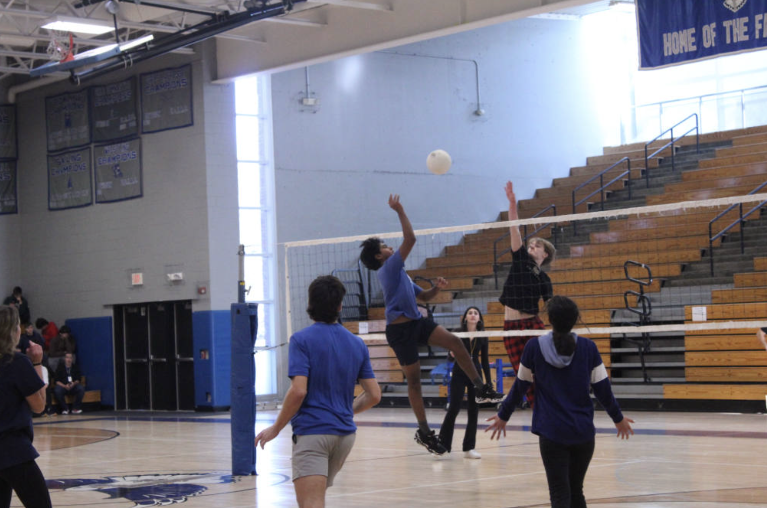 Aakash Anand and Brady True face off during the senior volleyball tournament.